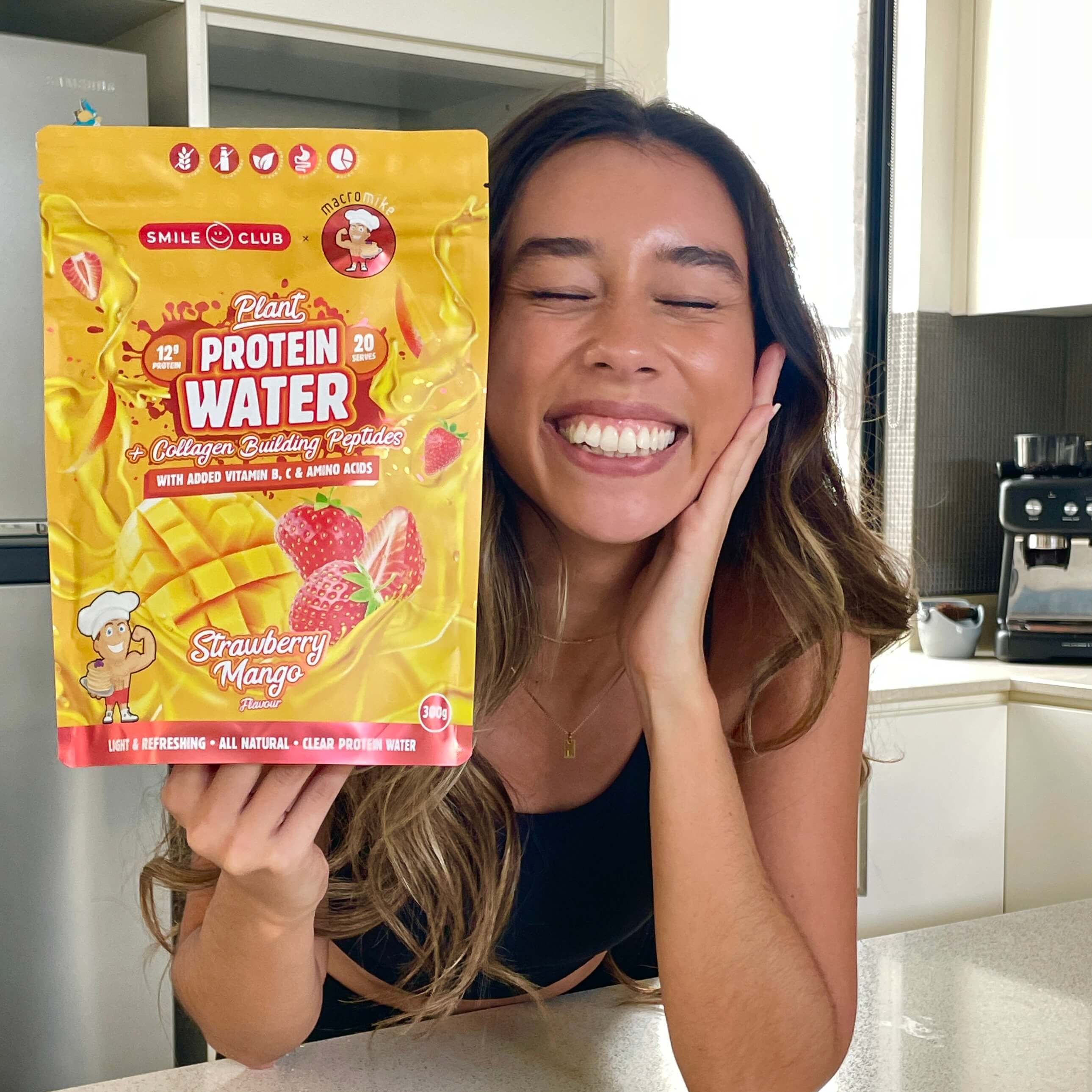 Model holding a Plant protein water bag